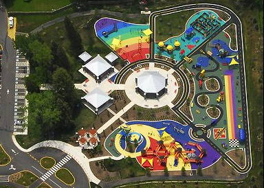 The Clemyjontri Park playground fills a 2 acre site in Fairfax VA, and features four outdoor "rooms" surrounding a central carousel 